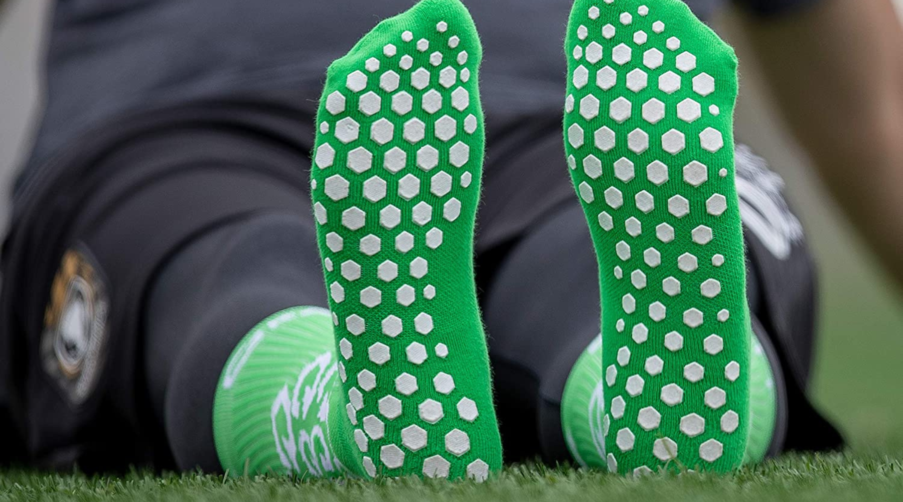 Why to avoid wearing grip socks with silicone pieces on the bottom?